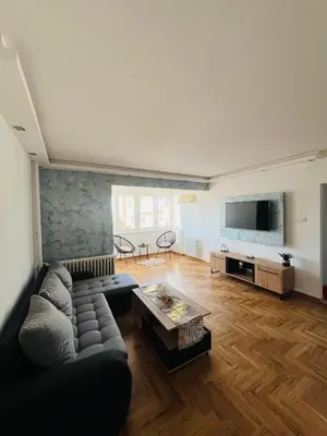 a living room with a couch and a table at Apartment Ninana in Belgrade