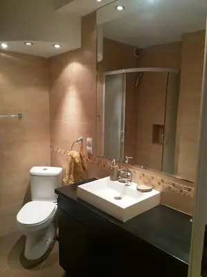a bathroom with a sink and a toilet and a mirror at Belgrade on water - City center in Belgrade