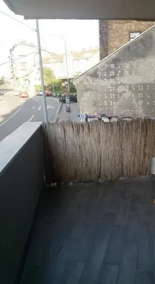 a fence next to a street with a building at Belgrade on water - City center in Belgrade