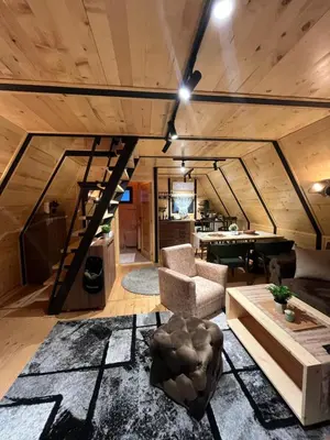 a living room with a couch and a table at Apartman Durtanoski 1 in Mali Mokri Lug