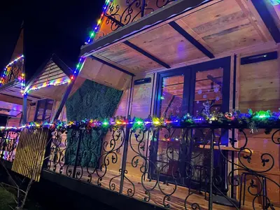 a balcony with christmas lights on it at Apartman Durtanoski 1 in Mali Mokri Lug