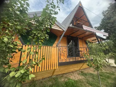 a house with a balcony on the side of it at Apartman Durtanoski 1 in Mali Mokri Lug
