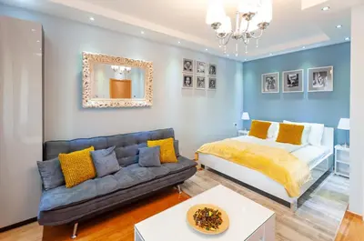 a living room with a bed and a couch at Bed & Breakfast Garden40 in Belgrade