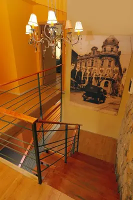a staircase in a room with a painting on the wall at Bed & Breakfast Garden40 in Belgrade