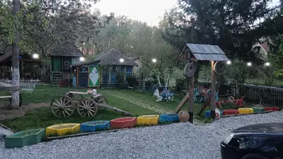 a childrens playground with a play set and a playintend at Etno selo Dukat in Belo Polje