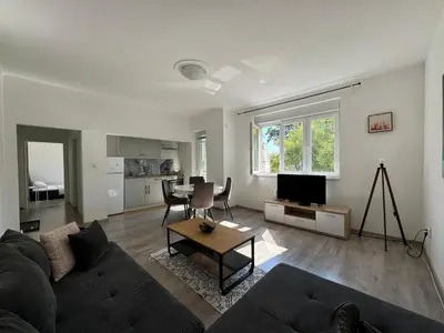 a living room with a couch and a table at KALEMEGDAN Apartment - Belgrade in Belgrade