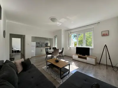 a living room with a couch and a table at KALEMEGDAN Apartment - Belgrade in Belgrade