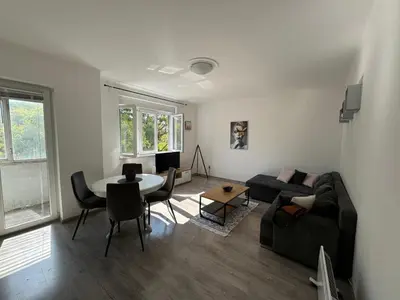 a living room with a couch and a table at KALEMEGDAN Apartment - Belgrade in Belgrade