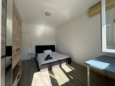a small bedroom with a bed and a desk at KALEMEGDAN Apartment - Belgrade in Belgrade