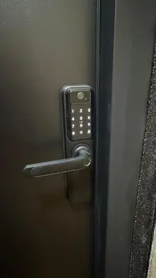 a door with a cell phone on a handle at LUNI Apartmants Vracar in Belgrade