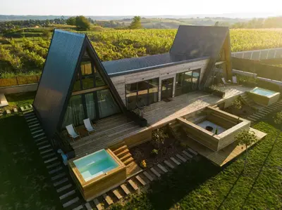 a house with a deck and a swimming pool at SunMoon Kosmaj kućice i prostor za događaje in Sopot