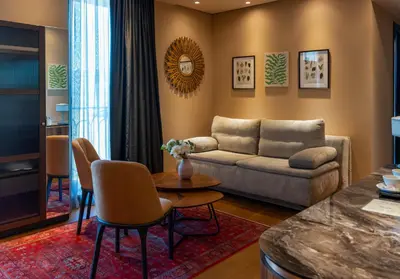 a living room with a couch and a table at Hyde Hill Kosmaj in Sopot