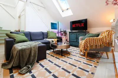 a living room with two couches and a tv at Pintrst-Penthouse 110m2 Ping Pong Old Town in Belgrade