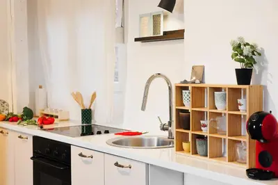 a kitchen counter with a sink and a sink at Pintrst-Penthouse 110m2 Ping Pong Old Town in Belgrade