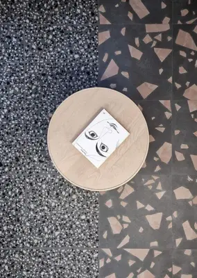 a wooden table with a drawing on it on a floor at Studio MAXIM in Vračar (historical)