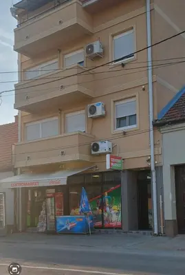 a building with two cameras on the side of it at Centro apartman 2 in Pančevo
