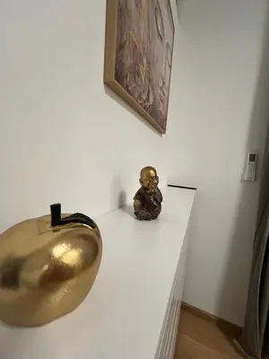 a gold bowl sitting on a white counter in a room at Studio 54 in Belgrade