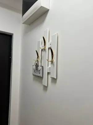 a wall with two hooks on a wall at Studio 54 in Belgrade