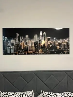 a painting of a city skyline on a wall at Studio 54 in Belgrade