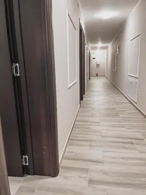 a hallway of an office building with a long corridor at Prenoćište Katarina JUGOVO in Smederevo