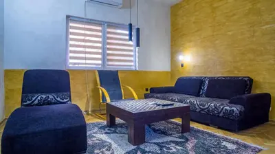 a living room with a couch and a coffee table at Lukas Apartment in Belgrade