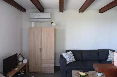 a living room with a couch and a cabinet at View Point House in Smederevo