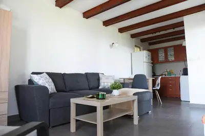 a living room with a couch and a table at View Point House in Smederevo