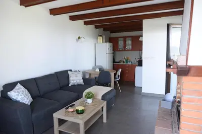 a living room with a couch and a table at View Point House in Smederevo