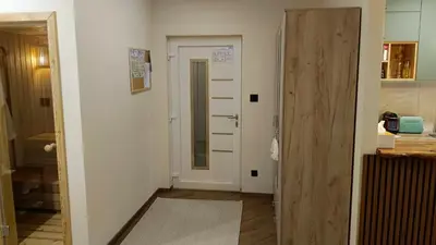 a hallway with a door leading to a room at Eden Spa Apartman in Arandjelovac