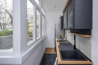 a kitchen with a sink and a window at Top Central 6 Apartments in Belgrade