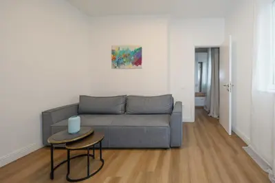 a living room with a couch and a table at Top Central 6 Apartments in Belgrade