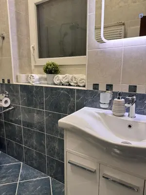 a bathroom with a sink and a mirror at BD Old Town Suite - Pedestrian Zone - City Center in Belgrade