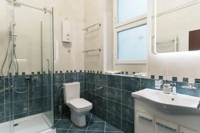 a bathroom with a toilet and a sink and a shower at BD Old Town Suite - Pedestrian Zone - City Center in Belgrade