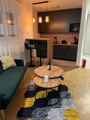 a living room with a couch and a table at R&B apartments in Belgrade