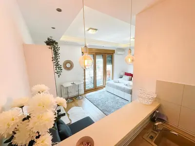 a living room with a couch and a table at SARA Lux A Blok in Belgrade