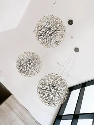 a group of spheres hanging from a ceiling at SARA Lux A Blok in Belgrade
