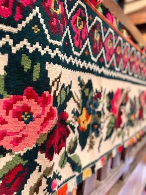 a close up of a rug with flowers on it at Guesthouse Perunov Konak in Belgrade