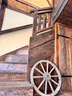 an old wooden cart with a wooden wheel at Guesthouse Perunov Konak in Belgrade