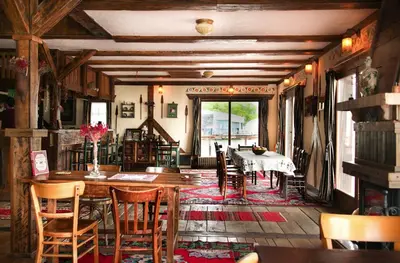 a dining room with a table and chairs at Guesthouse Perunov Konak in Belgrade