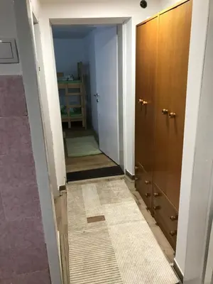 a hallway with a door and a tile floor at Family escape apartment free parking in Belgrade