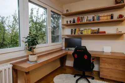 a home office with a desk and a chair at Bright, Newly Renovated Condo Near Danube River in Belgrade