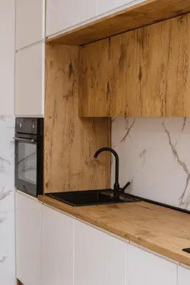 a kitchen with a sink and a counter top at Bright, Newly Renovated Condo Near Danube River in Belgrade