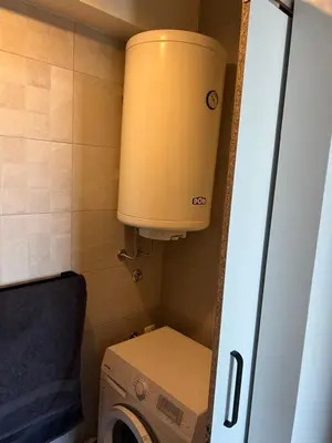 a washer and dryer in a small bathroom at Oasis Residences A in Belgrade