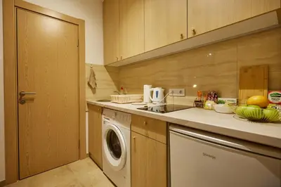 a kitchen with a washing machine and a washer at Best choice Hram centar in Belgrade