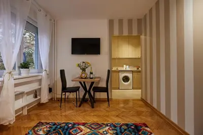 a living room with a table and a kitchen at Best choice Hram centar in Belgrade