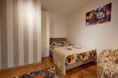 a small room with a bed and a chair at Best choice Hram centar in Belgrade