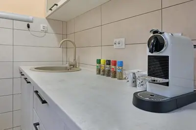 a kitchen with a counter with a coffee maker on it at Biser 17 in Zemun