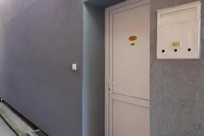 a door next to a wall next to a building at Biser 17 in Zemun