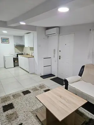 a living room with a couch and a table at Atina in Žarkovo