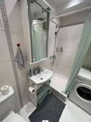 a bathroom with a sink and a toilet and a shower at Relax apartman bg in Belgrade